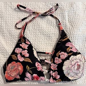 Billabong reversible bikini top. Floral/teardrop pattern. Size MD.